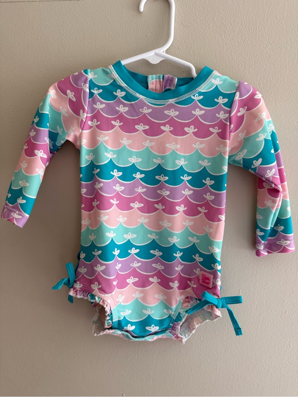 Ruffle Butts Baby Girl Rashguard Long Sleeve One-Piece Swimsuit in Pastel Waves